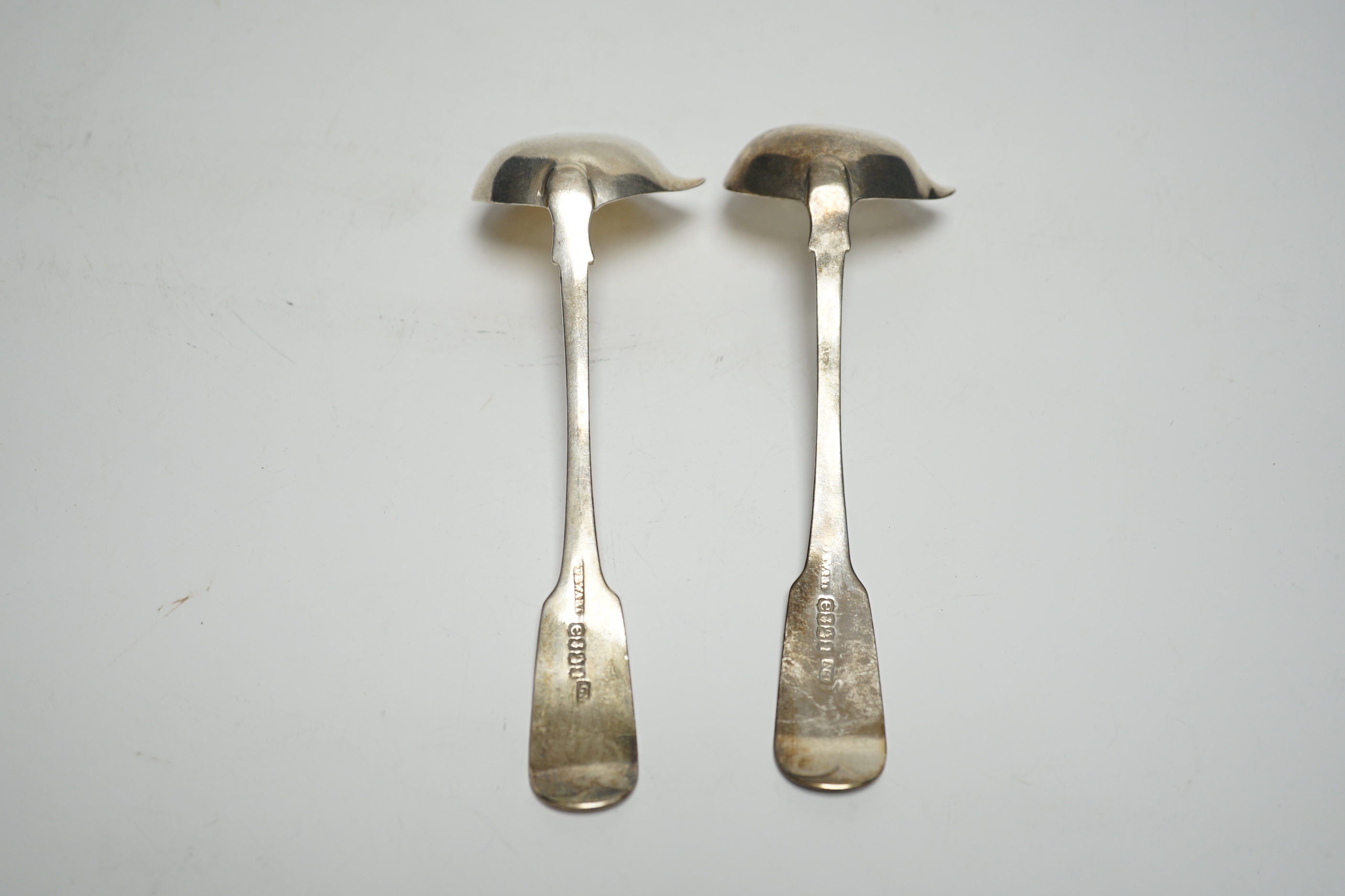 A pair of George IV Irish silver fiddle pattern sauce ladles, Lawrence Nowlan, Dublin, 1825, 15.8cm.